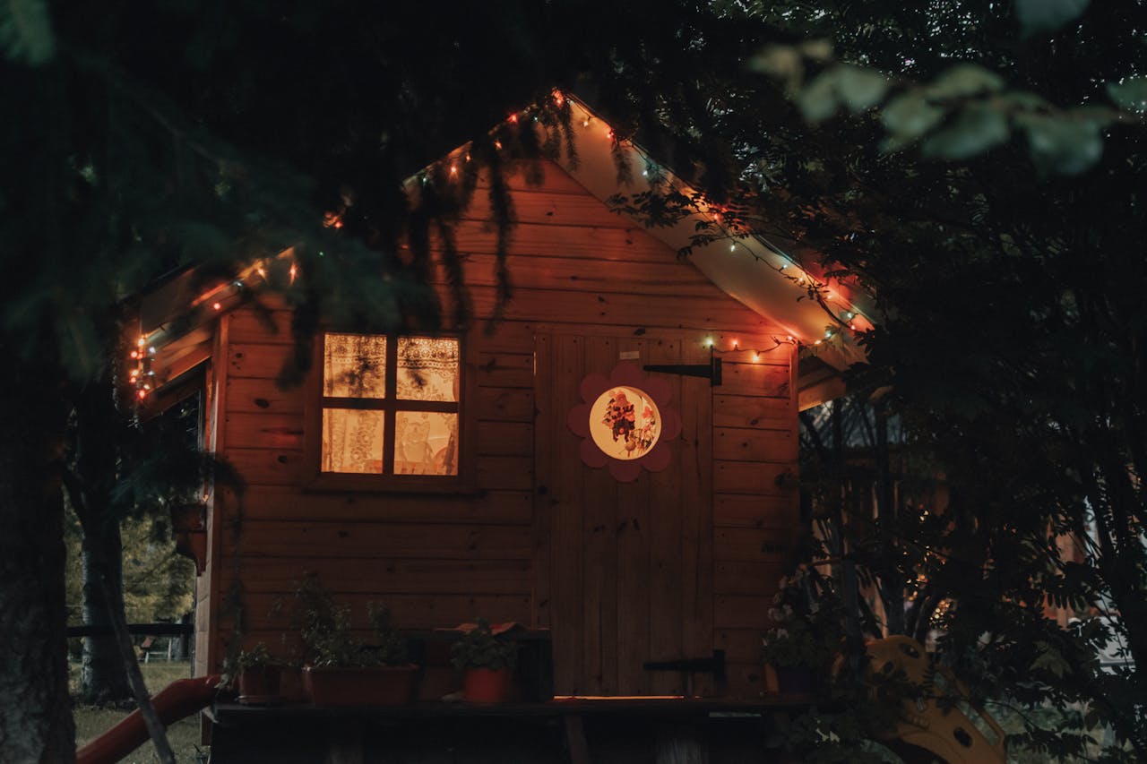 wooden cabin illuminated with christmas lights