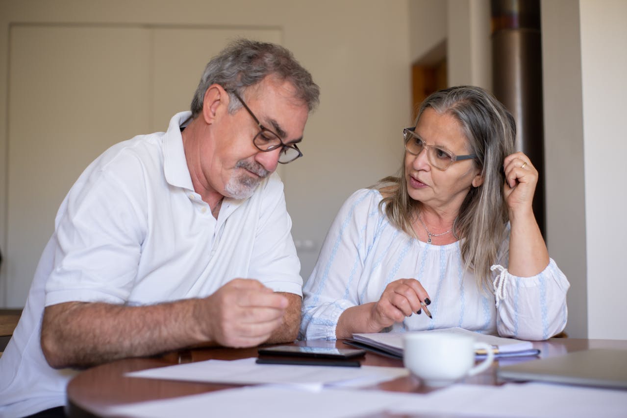 couple reviewing finances at table landscape